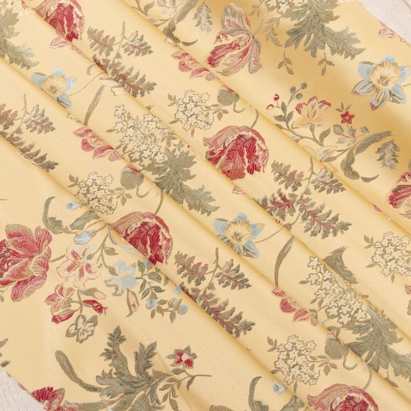 Venetian-style lampas fabric with pastel yellow background and baroque floral embroidery in shades of red, sage green, light blue and cream. Ideal for elegant furnishings, classic upholstery, curtains and decorative pillows. High quality craftsmanship Made in Italy.